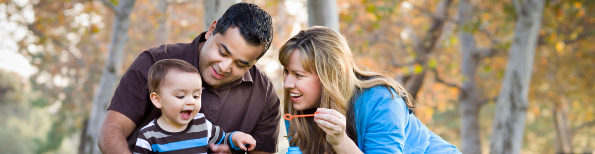 family blowing bubbles